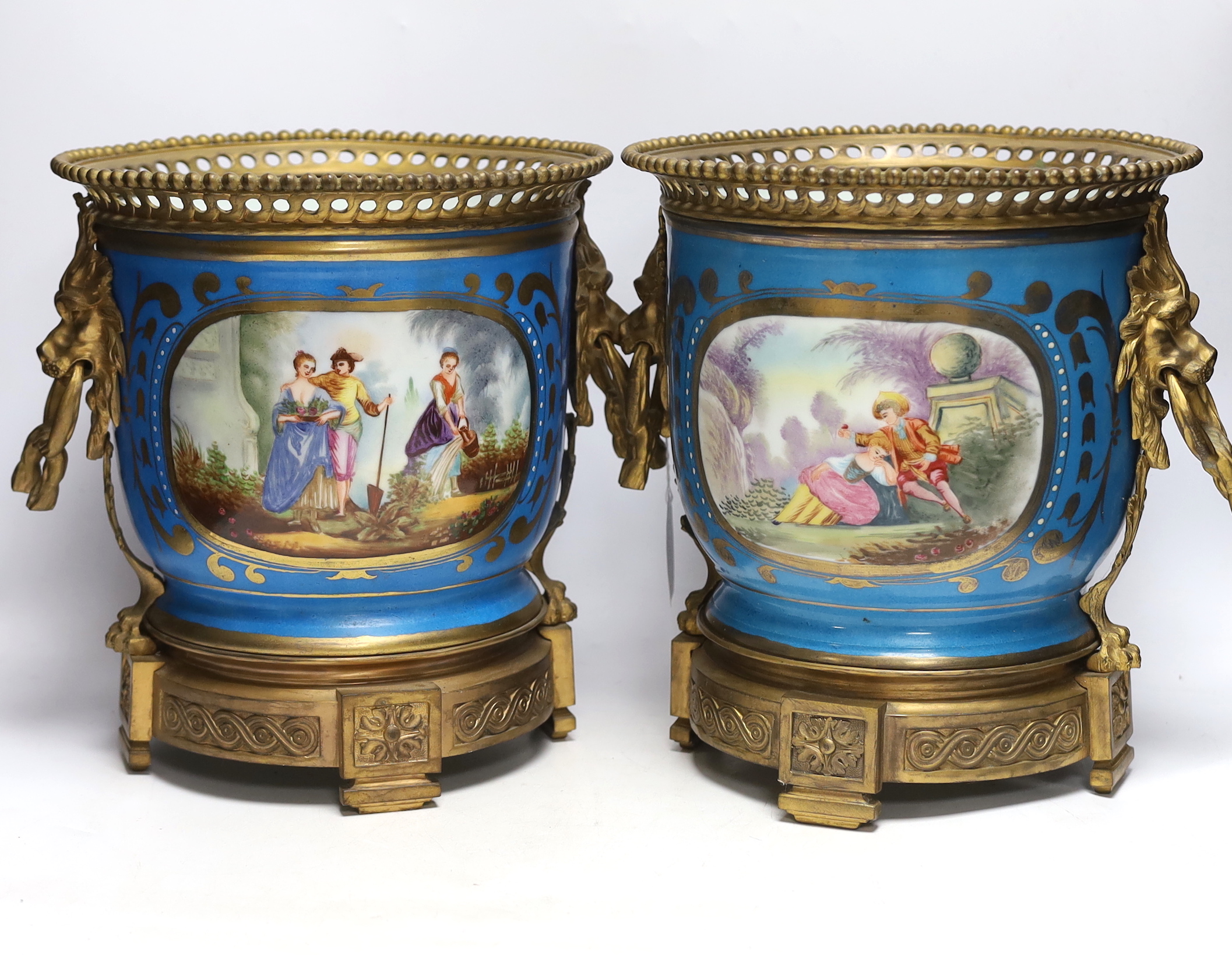 A pair of ormolu mounted Sevres style cache pots, 29cm high